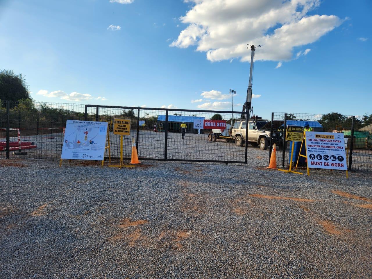 Mingomba drill site gate with safety signage